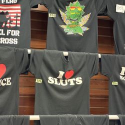 Sharky's Mackinaw Outfitters - T-shirts in poor taste for low class people, including deplorables.