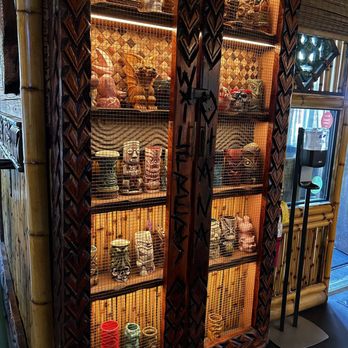 Wilfred's Lounge - This is the locked cabinet, with the " Regulars" personal drink containers. - Hawaiian Near Me - Napa, California
