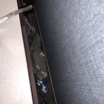 DoubleTree by Hilton Hotel Modesto - Previous guests belongings and trash left behind nightstand. Room 513 - Hotels Near Me - Modesto, California