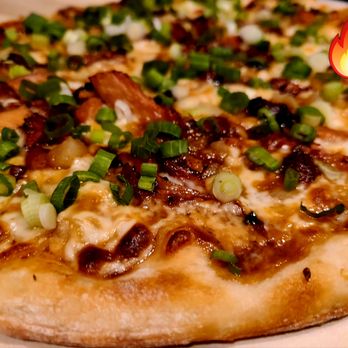 Tommy's Pizzeria - a close up of a pizza - Pizza Near Me Tommy's Pizzeria - a close up of a pizza - Pizza Near Me