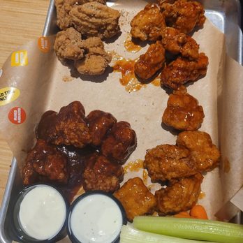 Buffalo Wild Wings - a tray of buffalo wings, celery sticks, and ranch dressings - Sports Bars Near Me - Dearborn, Michigan Buffalo Wild Wings - a tray of buffalo wings, celery sticks, and ranch dressings - Sports Bars Near Me - Dearborn, Michigan