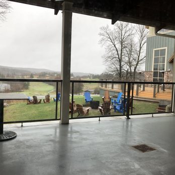Drift Kitchen + Bar - a patio with a view of a golf course - Canadian (New) Near Me - Huntsville, Ontario Drift Kitchen + Bar - a patio with a view of a golf course - Canadian (New) Near Me - Huntsville, Ontario