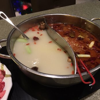 Happy Lamb Hot Pot - Big soup base split in half. - Mongolian Near Me - Toronto, Ontario