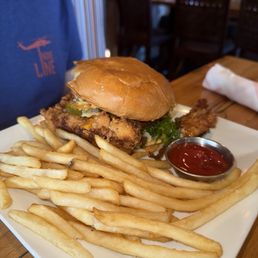 The Chicken sandwich comes with pimento cheese, slaw, and sweet pickles. Large enough to share!