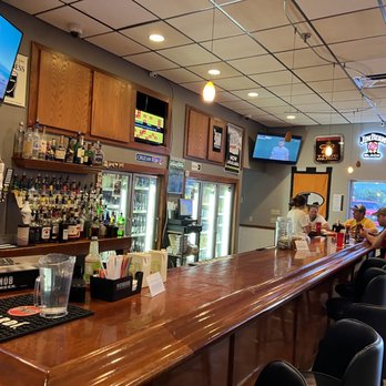 Three 21 Tavern - a bar with people sitting at the bar - Salad Near Me - Lexington, Nebraska