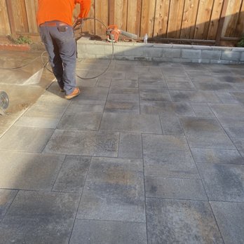 Bay Area Plus Landscaping - a man using a pressurer on a patio - Landscaping Near Me Bay Area Plus Landscaping - a man using a pressurer on a patio - Landscaping Near Me