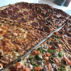 Gordon Pizza and Wings - Biggest and freshest slices! Purchase of one slice includes a pop or a dipping sauce of choice !