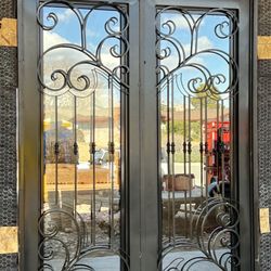 Puentes Ironworks - Our front doors being installed by Puentes Ironworks!