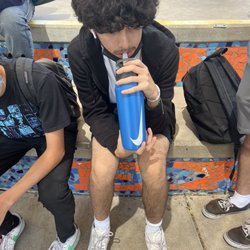 Thunderbird High School - Fellow young student drinking H2O to rehydrate after a long day of partaking in academical activity. What a jolly good fellow.