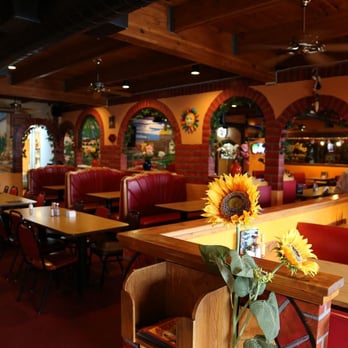 Azteca - Colorful, hand-painted murals and brightly colored decor are featured. - Mexican Near Me - Davenport, Iowa