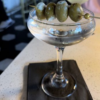 Dapper Dine & Lounge - Sapphire Bombay martini with 4 bleu cheese stuffed olives! - Cocktail Bars Near Me - Riverside, California Dapper Dine & Lounge - Sapphire Bombay martini with 4 bleu cheese stuffed olives! - Cocktail Bars Near Me - Riverside, California