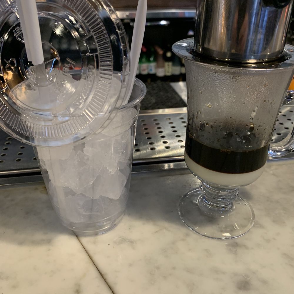District One Kitchen and Bar - Iced Coffee with condensed milk. Let it drop before stirring and pouring! - Asian Fusion Near Me - Las Vegas, Nevada District One Kitchen and Bar - Iced Coffee with condensed milk. Let it drop before stirring and pouring! - Asian Fusion Near Me - Las Vegas, Nevada