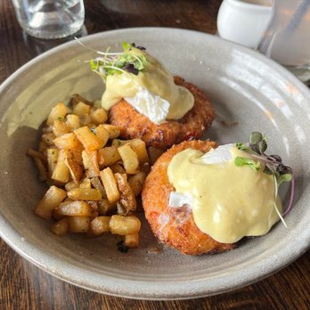 Uvae Kitchen & Wine Bar - Lobster Cake Benedict - poached egg, tarragon hollandaise with a side of potato hash - Wine Bars Near Me - Chicago, Illinois Uvae Kitchen & Wine Bar - Lobster Cake Benedict - poached egg, tarragon hollandaise with a side of potato hash - Wine Bars Near Me - Chicago, Illinois