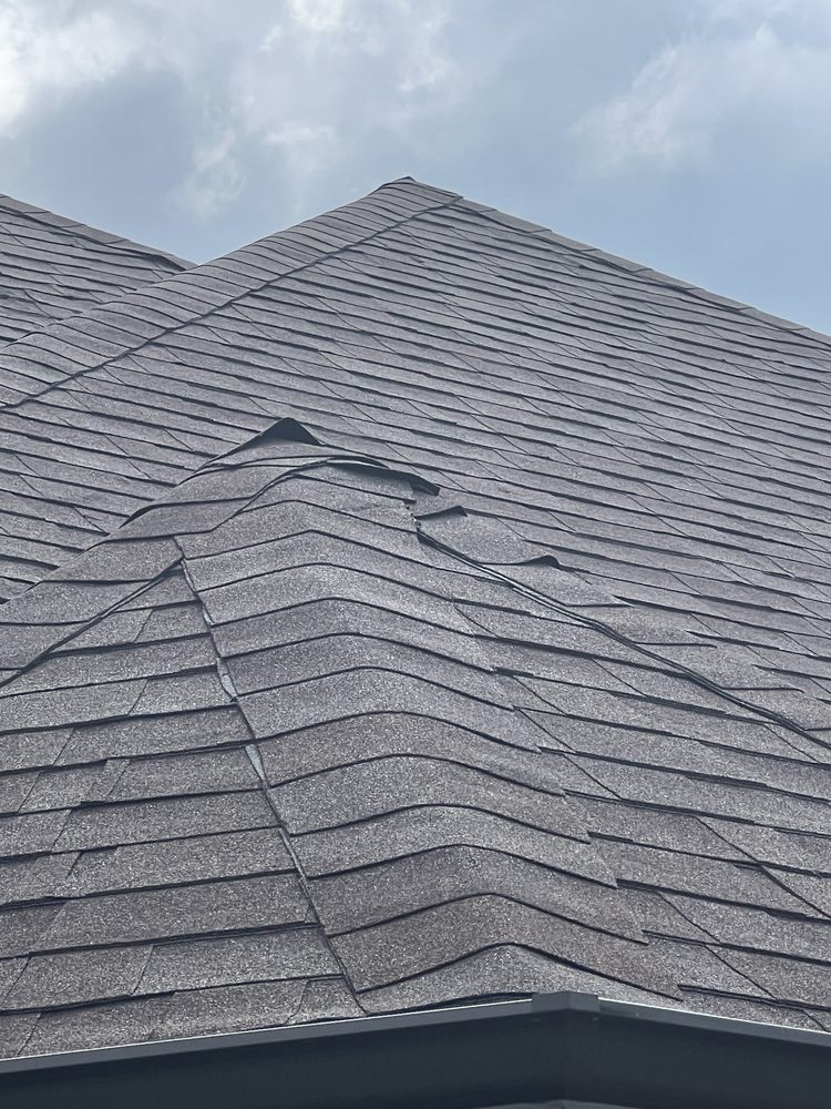 Slide of Tucker Roofing Systems