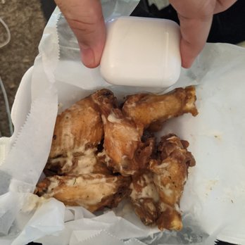 Ba-Da Wings - 7.5 oz of wings vs my Airpod case for size perspective. - Chicken Wings Near Me - Raleigh, North Carolina