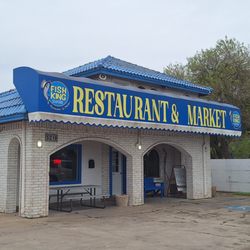 Fish King Seafood Restaurant and Market - This is the front of the restaurant, it has a parking lot, and it appears that there are two levels.