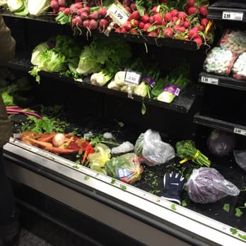 Mariano's - Roscoe Village - Produce area was a mess.  Yes - that's someone's glove laying in there... People seemed to abandon their bags and left. - Grocery Near Me - Chicago, Illinois