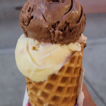 Millie's Homemade Ice Cream - a hand holding an ice cream cone - Ice Cream & Frozen Yogurt Near Me - Pittsburgh, Pennsylvania Millie's Homemade Ice Cream - a hand holding an ice cream cone - Ice Cream & Frozen Yogurt Near Me - Pittsburgh, Pennsylvania