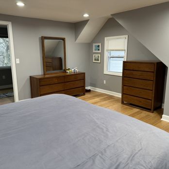 MeyMax Construction - a bedroom with a flat screen tv - General Contractors Near Me - Belleville, New Jersey