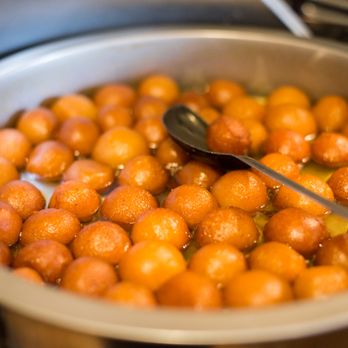 India Oven - a pan of oranges being cooked - Indian Near Me - Grass Valley, California India Oven - a pan of oranges being cooked - Indian Near Me - Grass Valley, California