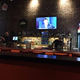 two men sitting at a bar two men sitting at a bar