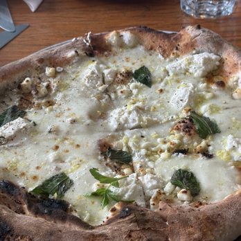Shelter - White pizza - ricotta,goat cheese, mozz, yellow&green zucchini, mint, lemon zest - Pizza Near Me - Woodstock, New York Shelter - White pizza - ricotta,goat cheese, mozz, yellow&green zucchini, mint, lemon zest - Pizza Near Me - Woodstock, New York