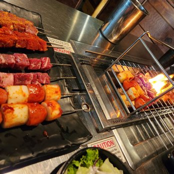 Gui Gui - various types of meat being cooked on a grill - Kebab Near Me - Toronto, Ontario