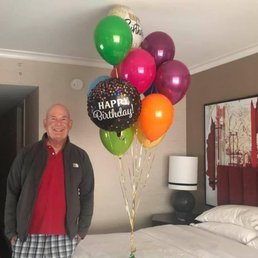 Basic helium balloon bouquet with two foil balloon add ons.