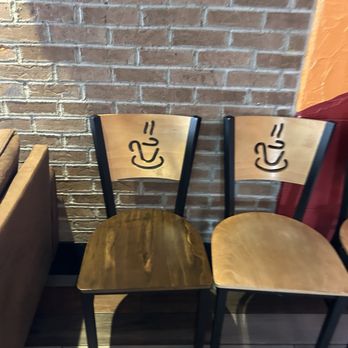 Crepes Tea House - The tea cup emblem on the chairs. - Coffee & Tea Near Me - West Springfield, Massachusetts