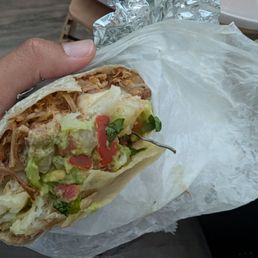 Carnitas burrito with a metal wire in it Carnitas burrito with a metal wire in it