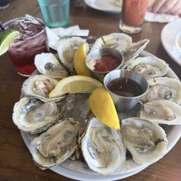 A dozen oysters and a half shell A dozen oysters and a half shell