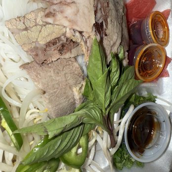 Pho 83 - P 6. Round Steak(RARE), Flank, and Brisket Noodle Soup/Phở Tái Nạm Gầu with chili oil on the side - Vietnamese Near Me - Newport News, Virginia Pho 83 - P 6. Round Steak(RARE), Flank, and Brisket Noodle Soup/Phở Tái Nạm Gầu with chili oil on the side - Vietnamese Near Me - Newport News, Virginia