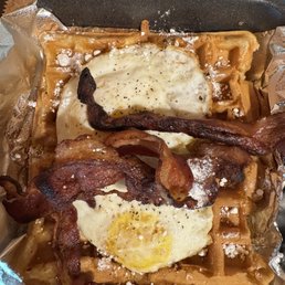 Hangover waffle burger with bacon and eggs. Make sure you get extra syrup and powder sugar Hangover waffle burger with bacon and eggs. Make sure you get extra syrup and powder sugar