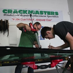 Crackmasters Windshield Repair and Replacement - putting urethane  on a windshield