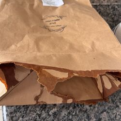 Bag broken from the restaurant not wrapping the containers in plastic wrap
