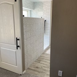 Diversified Remodeling - After bathroom remodel shower walk in and large barn door