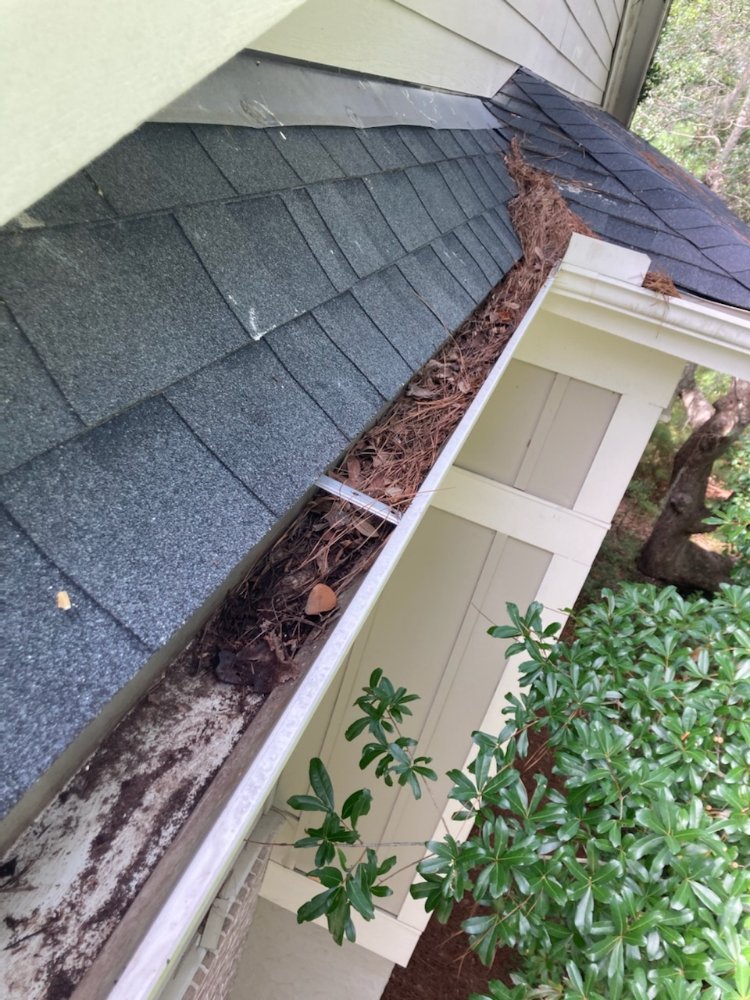 Slide of Roof and Gutter Cleaning