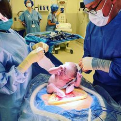 Edward C Spoon Jr., MD FACOG FACS - my baby with the time she was born. i don't have anyone with me but this was taken and im forever thankful for the kk d staff