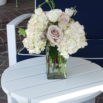 Cristina's Flowers - Beautiful centerpieces for first communion celebration! I ordered 6 and each were equally lovely and full of flowers. - Florists Near Me - Long Beach, California