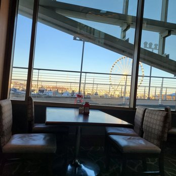 Sauciety - a view of a ferris wheel through a window - New American Near Me - National Harbor, Maryland Sauciety - a view of a ferris wheel through a window - New American Near Me - National Harbor, Maryland