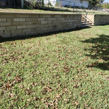 Jane Custom Masonry - 70 foot retaining wall with 10 foot wide steps - Masonry/Concrete Near Me - Del Valle, Texas