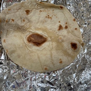 Yummy Taco - a tortilla wrapped in aluminum foil - Mexican Near Me - Jamaica, New York