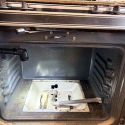 V. Appliance Repair - Igniter testing on a Caloric oven.