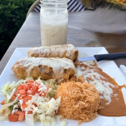 las palmas - Fried Chicken fajita chimichanga with rice and beans, covered with cheese sauce