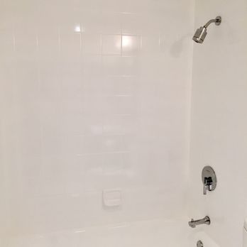 Porcelain Tub Restorations - After - Bathtub and surrounding wall tile (Bathroom 1) - General Contractors Near Me - Bowie, Maryland Porcelain Tub Restorations - After - Bathtub and surrounding wall tile (Bathroom 1) - General Contractors Near Me - Bowie, Maryland