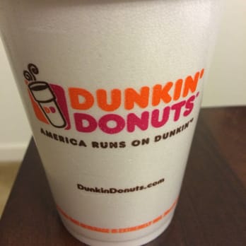 Dunkin' - a cup of coffee on a table - Donuts Near Me - Sarasota, Florida Dunkin' - a cup of coffee on a table - Donuts Near Me - Sarasota, Florida