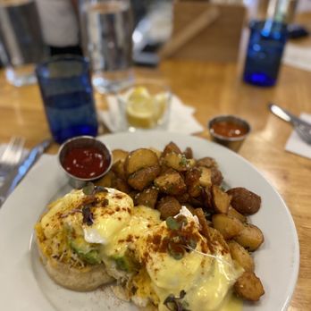 Bloom - JUMBO CRAB BENE $27 Fresh lump crab, avo, whole grain mustard, poached eggs, English muffin, scratch Hollandaise, micro greens, potatoes. - American Near Me - Santa Clara, California