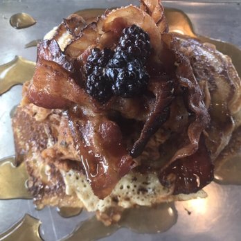 Industry - Porky's pancakes--$10 brunch plate with spicy pulled pork, crisp bacon, berry compote and bourbon maple syrup. A big hit with both of us. - New American Near Me - San Marcos, Texas Industry - Porky's pancakes--$10 brunch plate with spicy pulled pork, crisp bacon, berry compote and bourbon maple syrup. A big hit with both of us. - New American Near Me - San Marcos, Texas