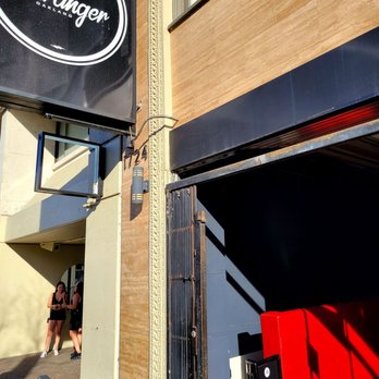 Hello Stranger - Signage from sidrwalk - Bars Near Me - Oakland, California