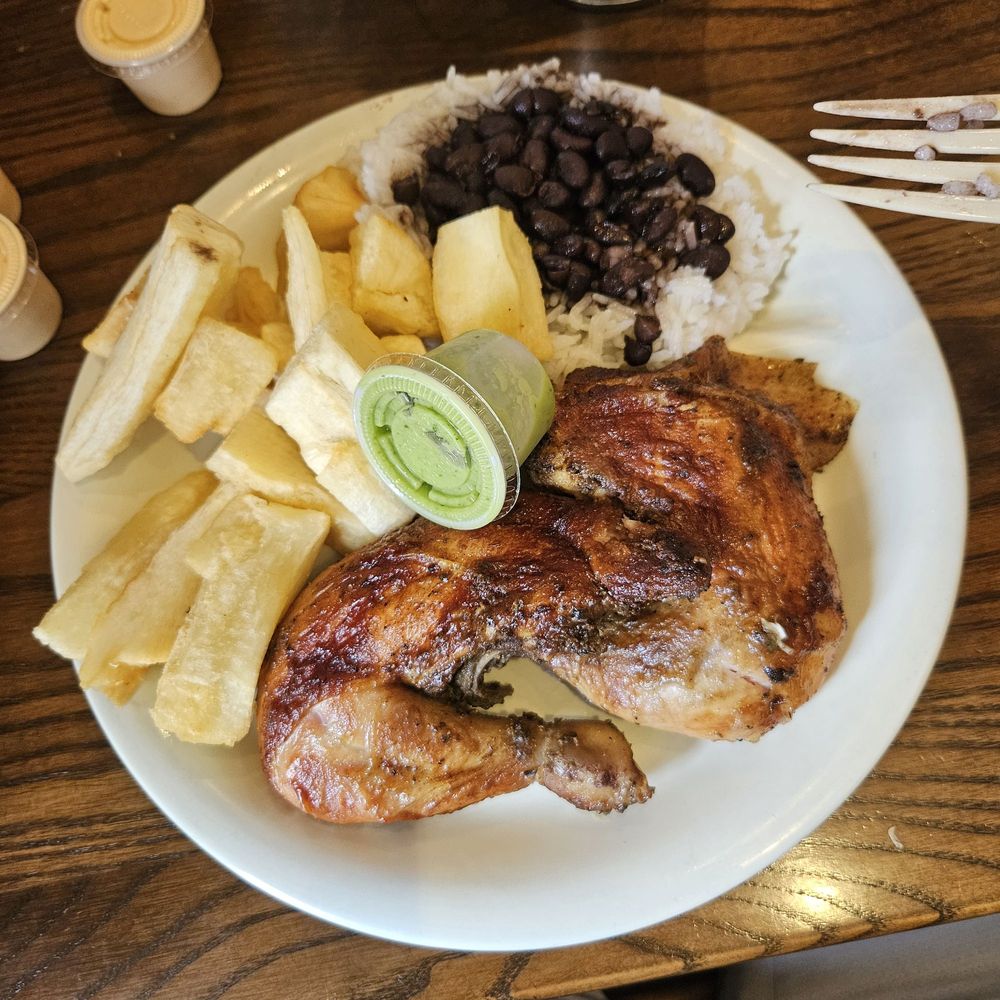 Half chicken dark with yucca, rice and beans. Half chicken dark with yucca, rice and beans.